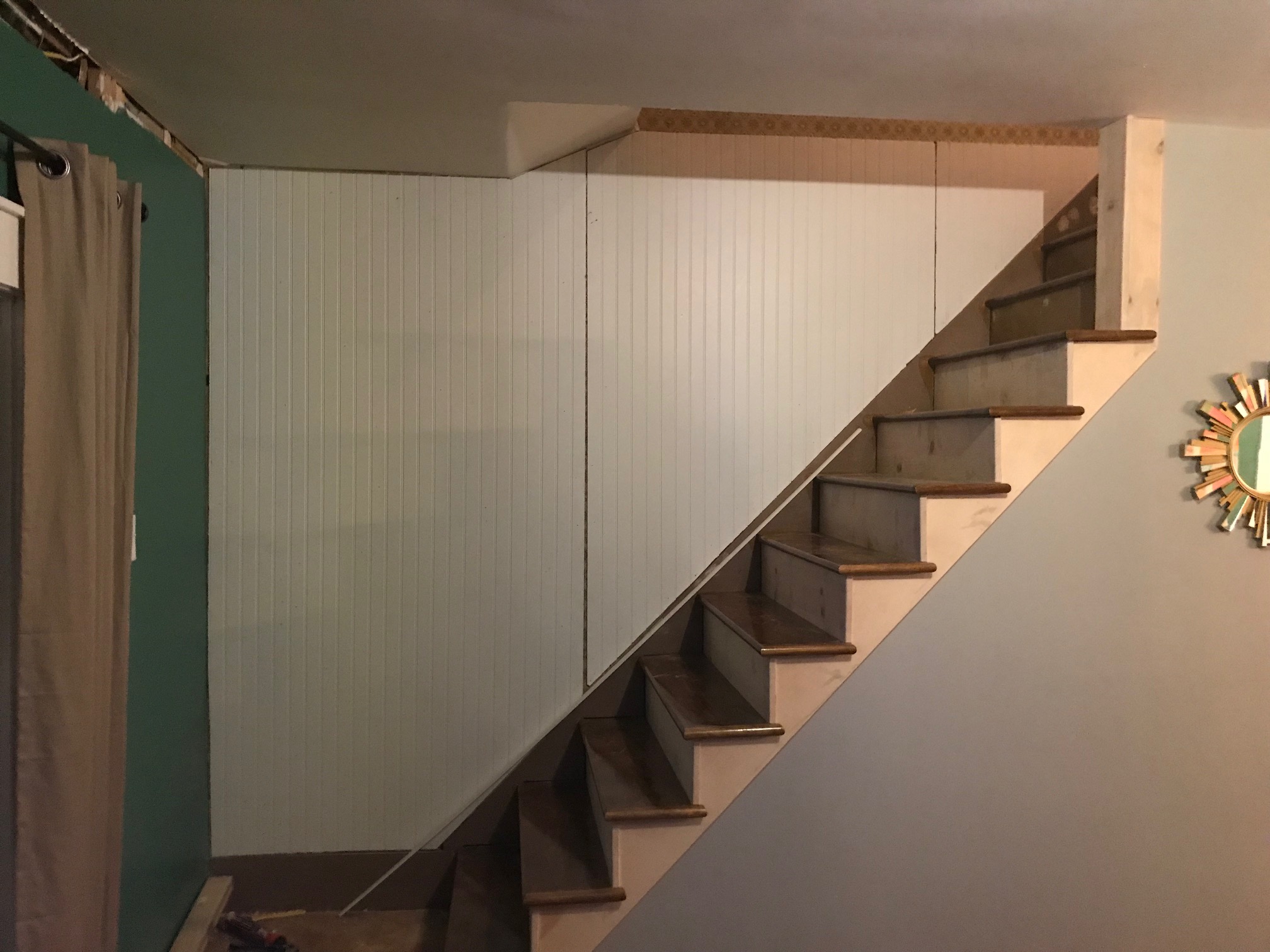 Installing the stair treads, risers, and skirtboard.