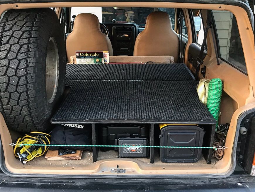 jeep xj cherokee cargo storage sleeping platform folding rear seat