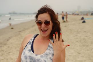 She said yes! Engagement ring, on the beach